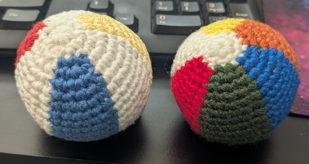 a picture of two crochet beach balls